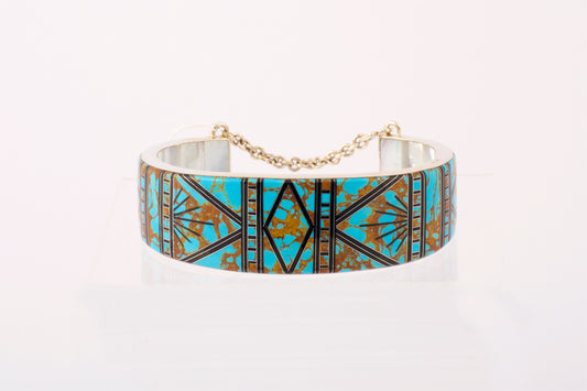 Silver Cuff with Turquoise, brass and black Inlay. Mother of Pearl inside the cuff.