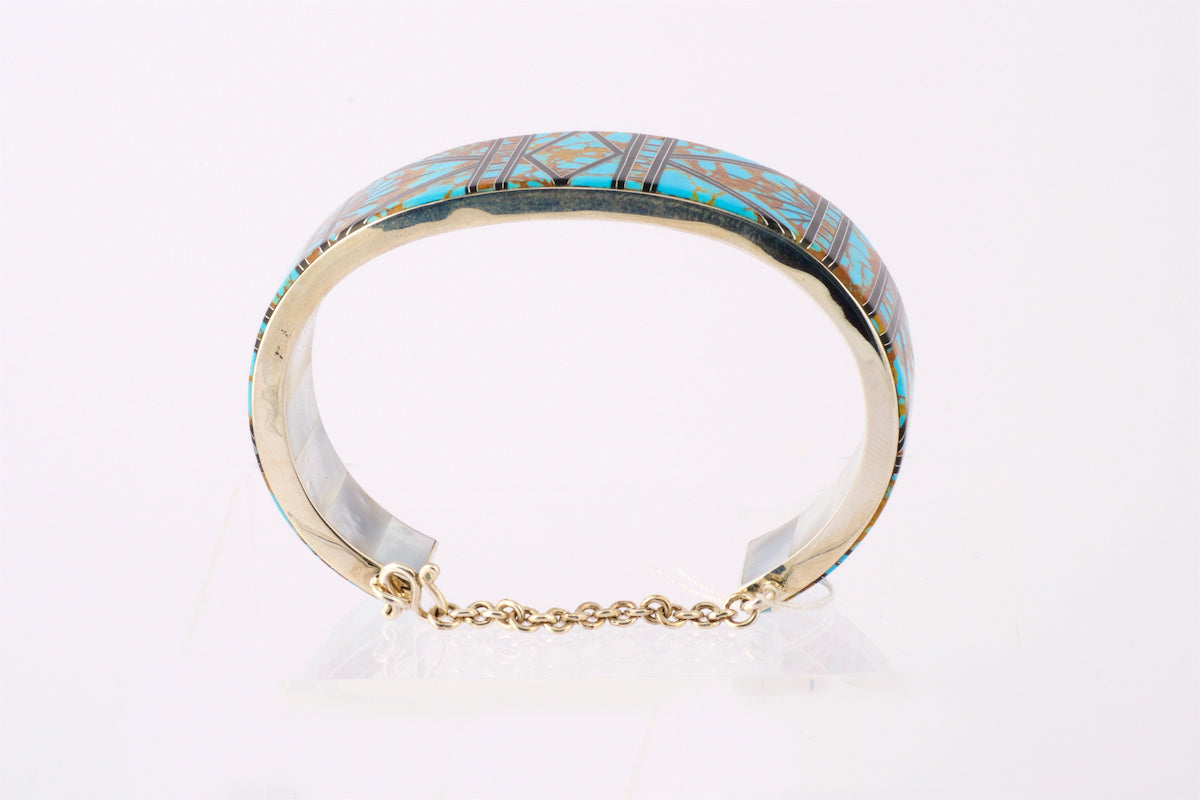 Silver Cuff with Turquoise, brass and black Inlay. Mother of Pearl inside the cuff.