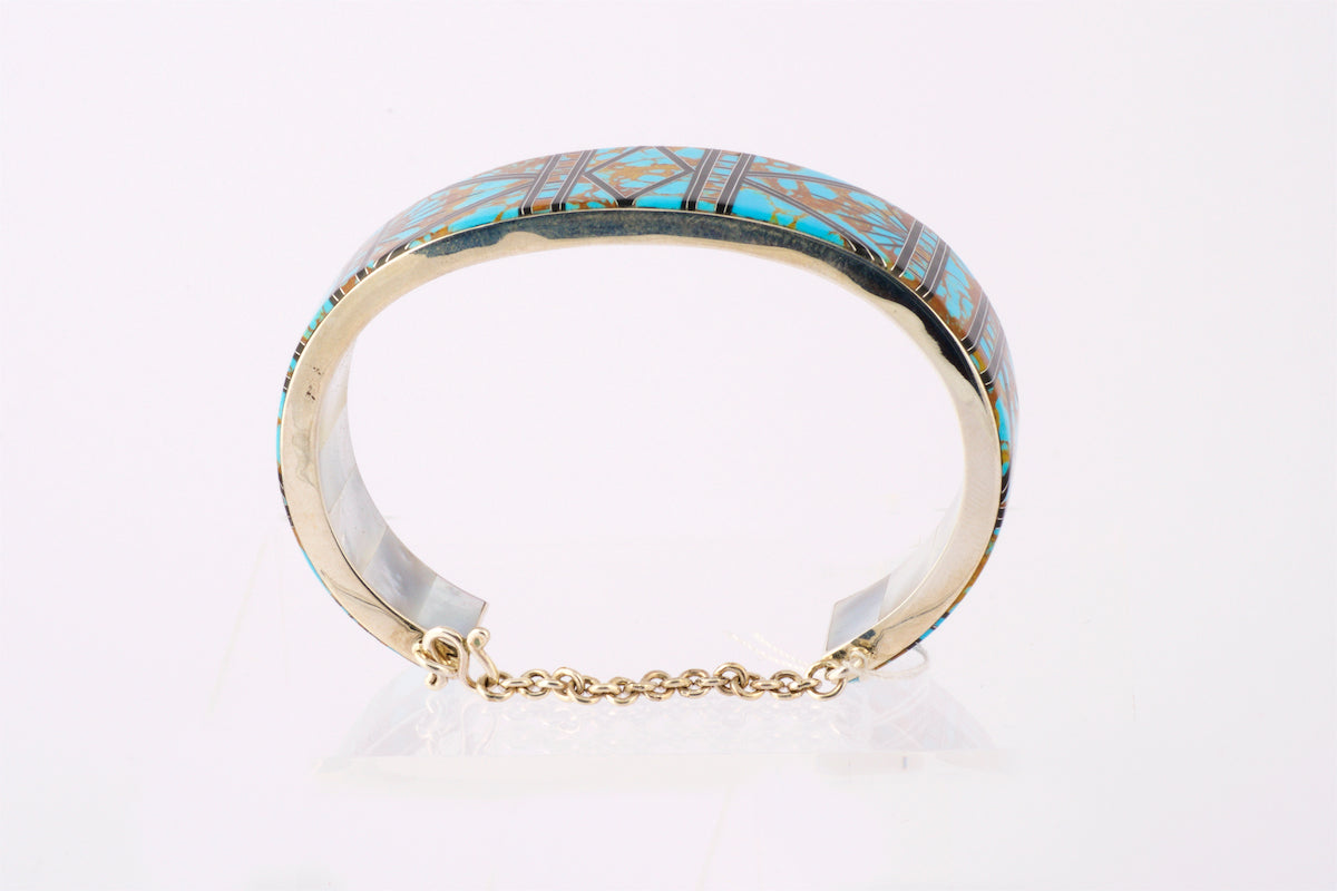 Silver Cuff with Turquoise, brass and black Inlay.  Mother of Pearl inside the cuff.