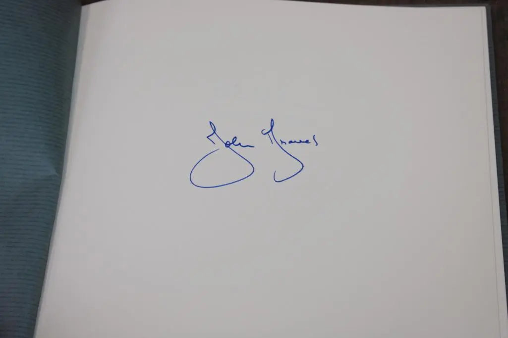BOOKS - A collection of John Graves books, including one signed by the author