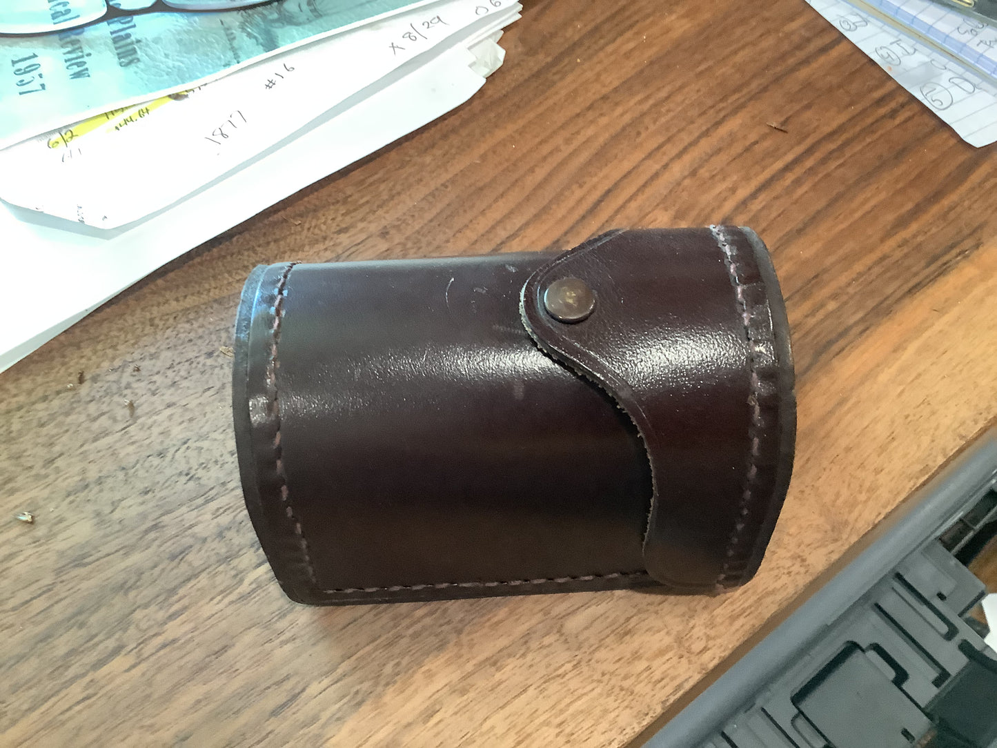 J.A. Coxe - Bronson, Michigan  fishing reel and leather case.