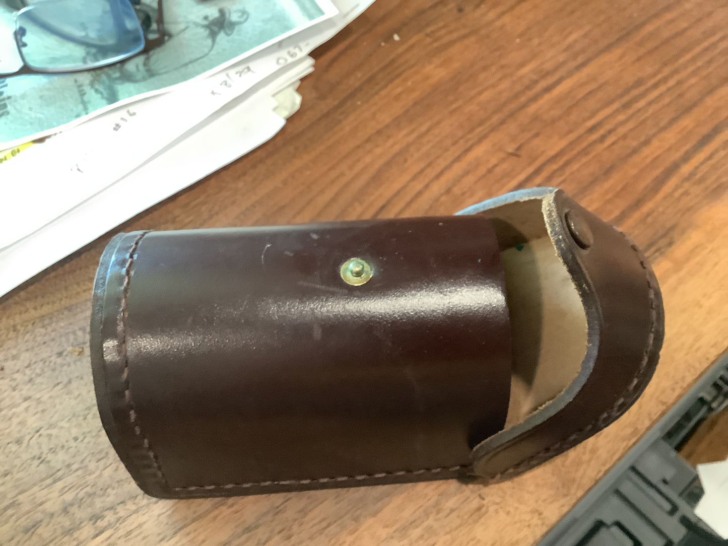 J.A. Coxe - Bronson, Michigan  fishing reel and leather case.