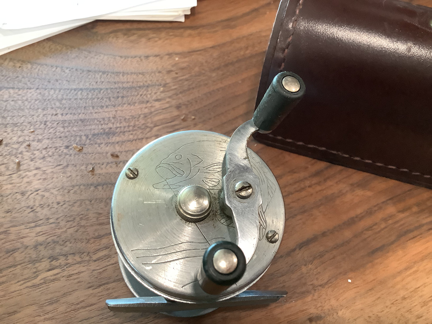 J.A. Coxe - Bronson, Michigan  fishing reel and leather case.