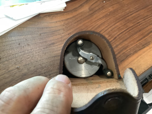 J.A. Coxe - Bronson, Michigan  fishing reel and leather case.