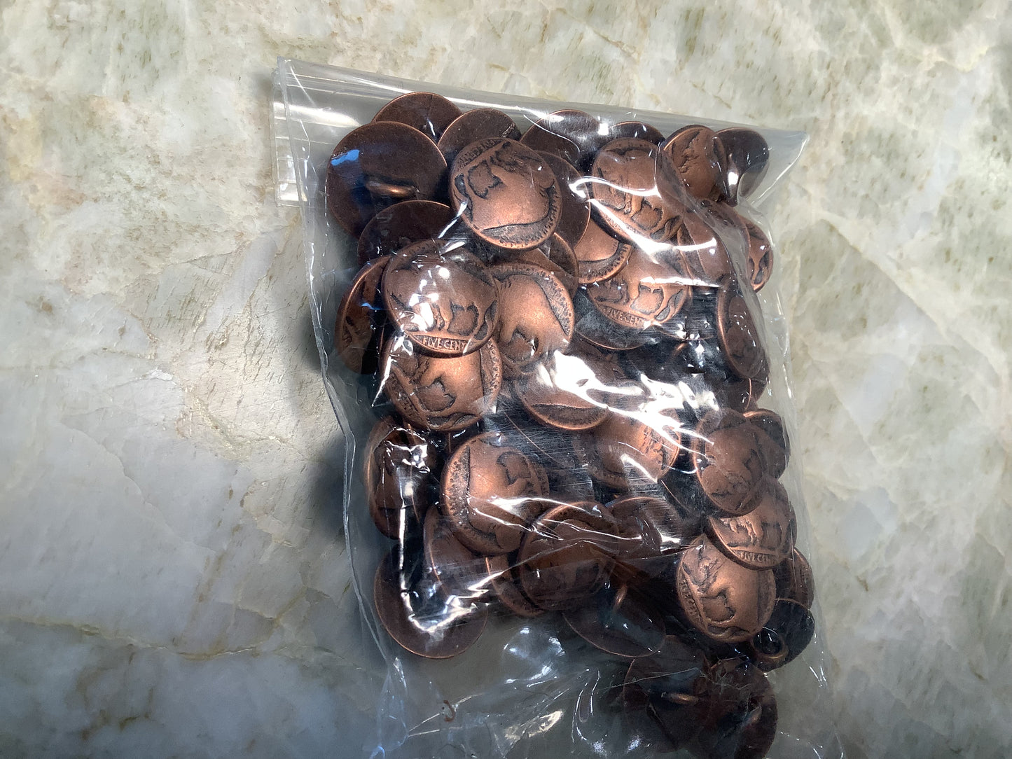 Copper colored (or very likely actual copper) Buffalo Nickel style buttons