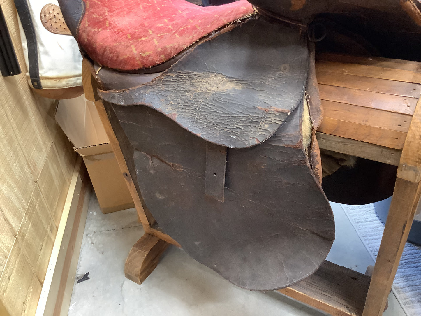 Antique Side Saddle with iron stirrup.