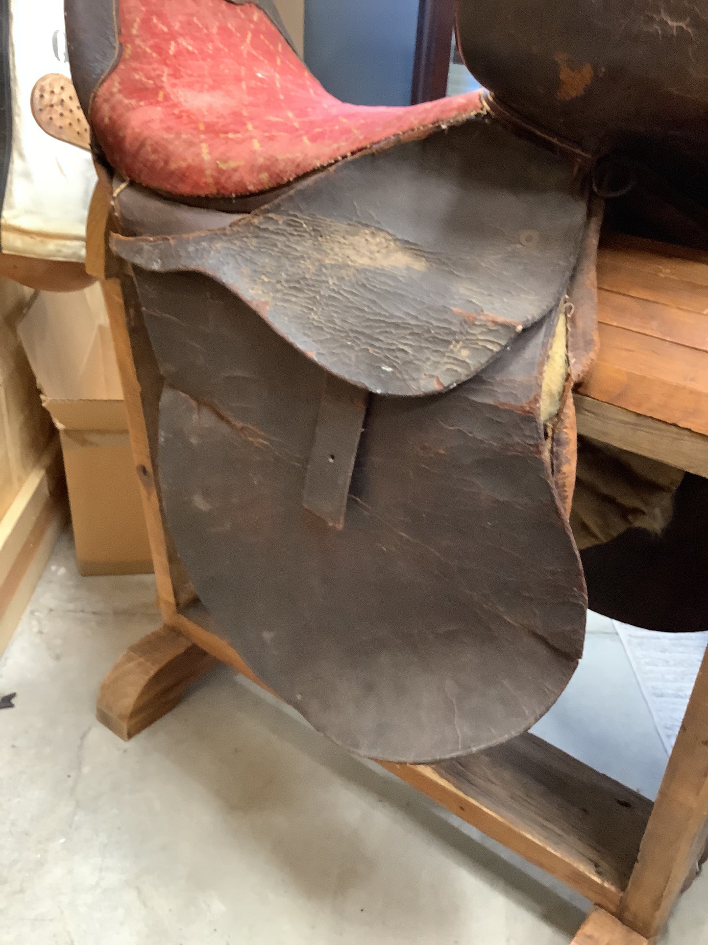 Antique Side Saddle with iron stirrup.