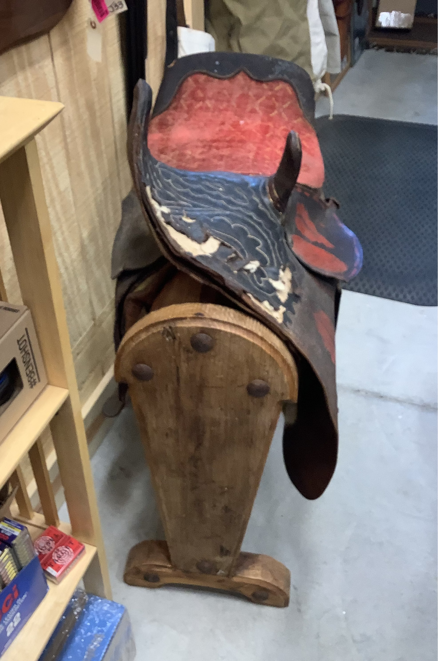 Antique Side Saddle with iron stirrup.