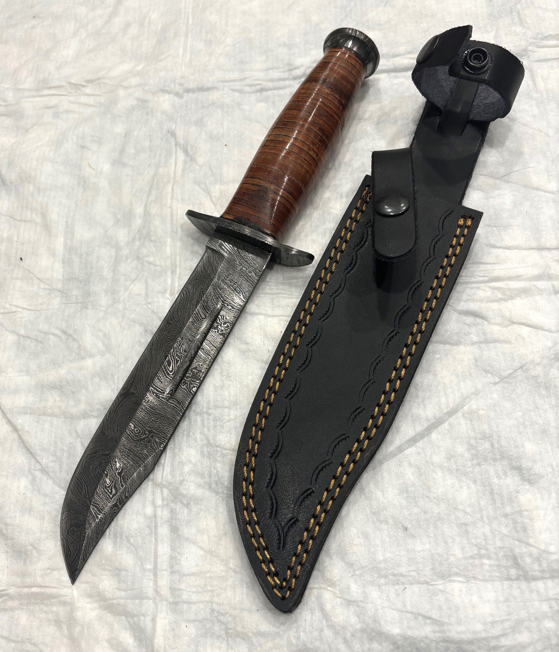 Damascus Steel "Ka-Bar" duplicate with stacked leather handle