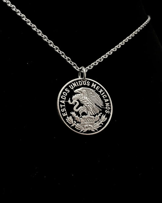 Mexico – cut by hand from an actual Mexican 50 centavos coin. It features the National Arms of Mexico - Cut Coin Jewelry from Jarrett Leone in New Hampshire (Copy)