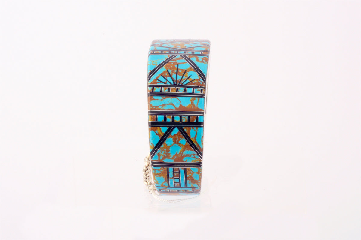 Silver Cuff with Turquoise, brass and black Inlay.  Mother of Pearl inside the cuff.